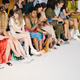 Tevas and sneaks in the front row of Collina Strada.